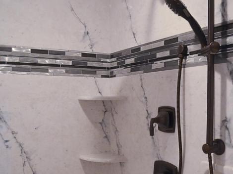 Carrara marble in black with tile accent border